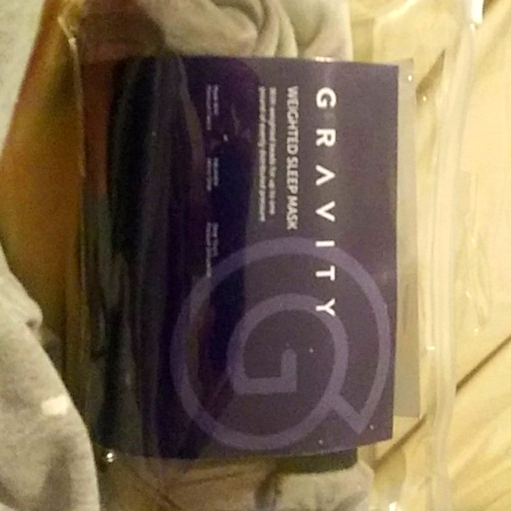 Gravity weighted sleep mask
